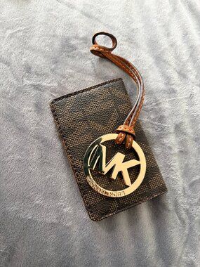 Michael Kors card case and logo bag charm